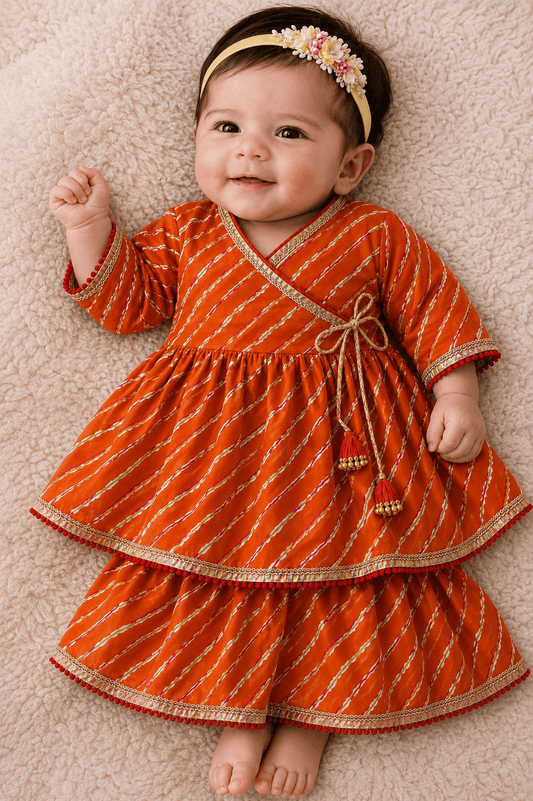 Baby Girls Orange Leheriya Print Angrakha Festive Dress | Infant Traditional Layered Cotton Frock with Tassels